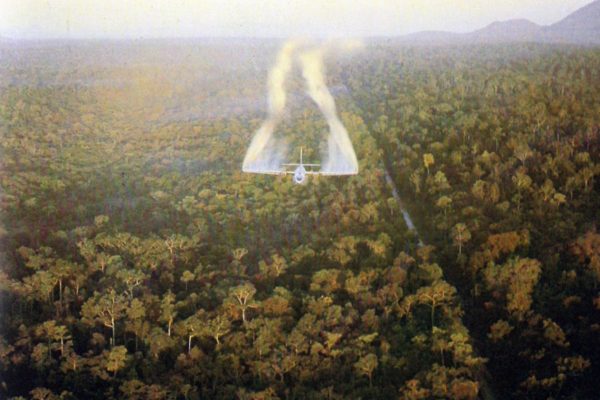 Us military transport plane uc-123 spraying agent orange on jungle.
